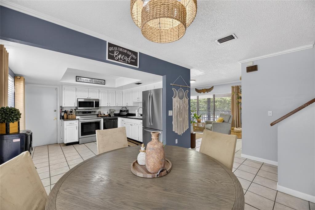 6609 Jennifer Drive Temple Terrace, FL 33617 - Photo 14 of 49 a view of kitchen with stainless steel appliances kitchen island granite countertop a stove and cabinets