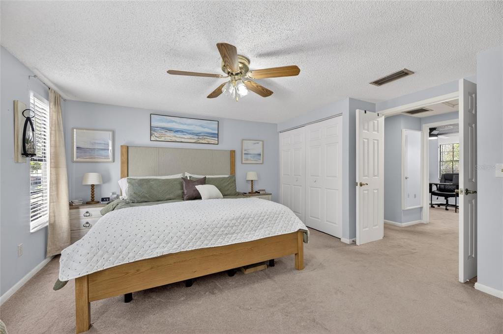 6609 Jennifer Drive Temple Terrace, FL 33617 - Photo 21 of 49 a bedroom with a bed and ceiling fan