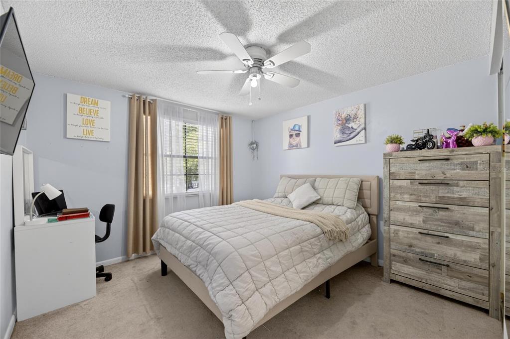 6609 Jennifer Drive Temple Terrace, FL 33617 - Photo 27 of 49 a bedroom with a bed and a window