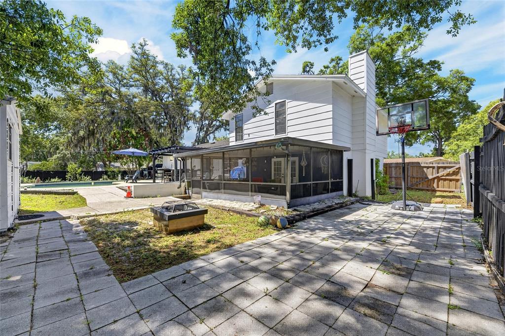 6609 Jennifer Drive Temple Terrace, FL 33617 - Photo 37 of 49 a view of a house with swimming pool and sitting area