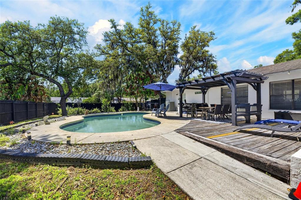 6609 Jennifer Drive Temple Terrace, FL 33617 - Photo 38 of 49 a view of a backyard with a patio