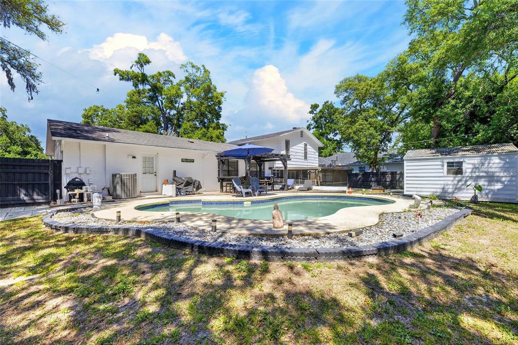 6609 Jennifer Drive Temple Terrace, FL 33617 - Photo 43 of 49 a view of a swimming pool with a patio