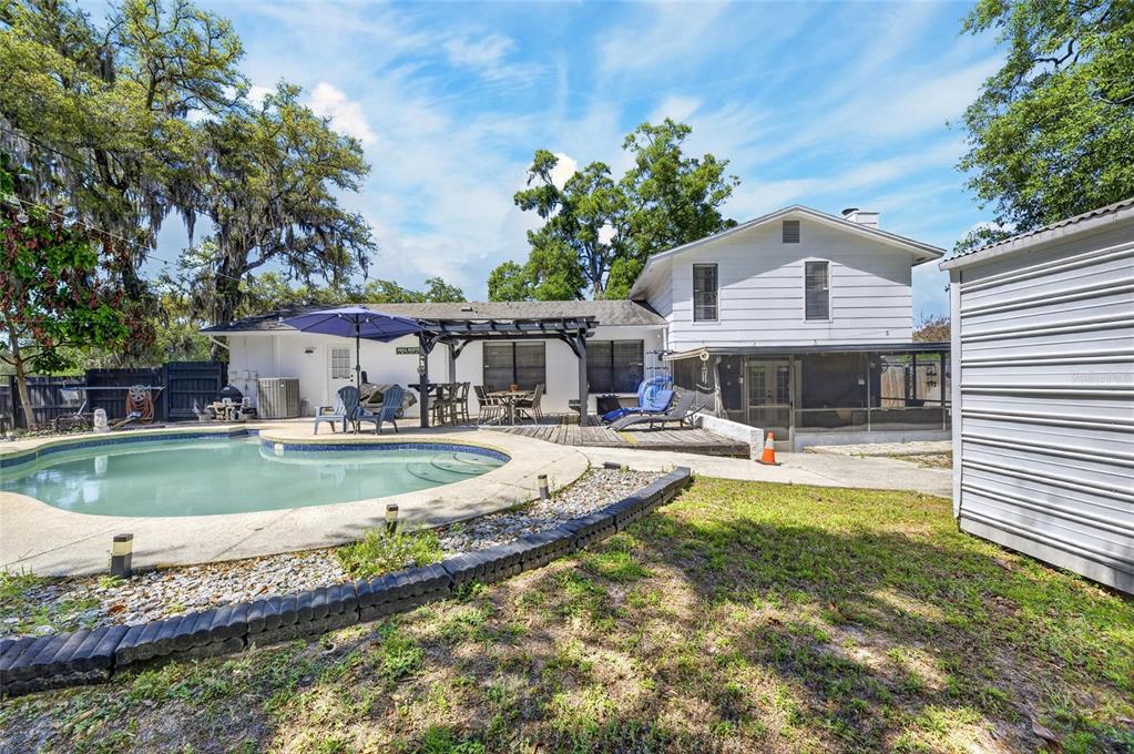 6609 Jennifer Drive Temple Terrace, FL 33617 - Photo 44 of 49 a view of a house with swimming pool and sitting area