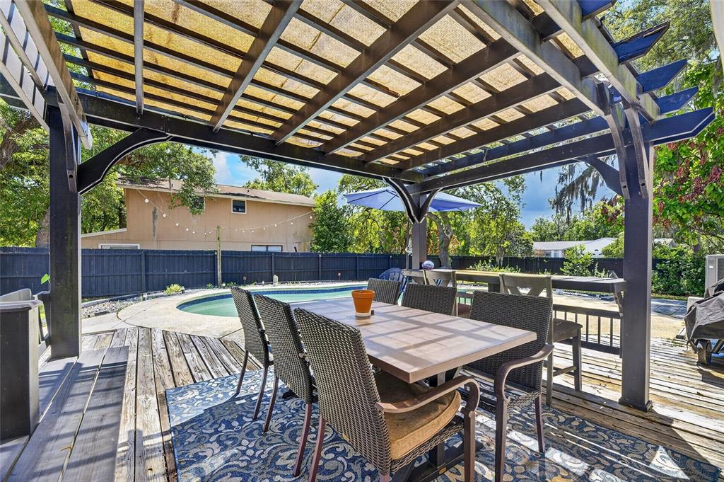 6609 Jennifer Drive Temple Terrace, FL 33617 - Photo 47 of 49 a patio with glass top table and chairs