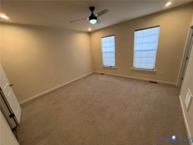 a view of a kitchen with kitchen island a sink wooden floor and counter top space