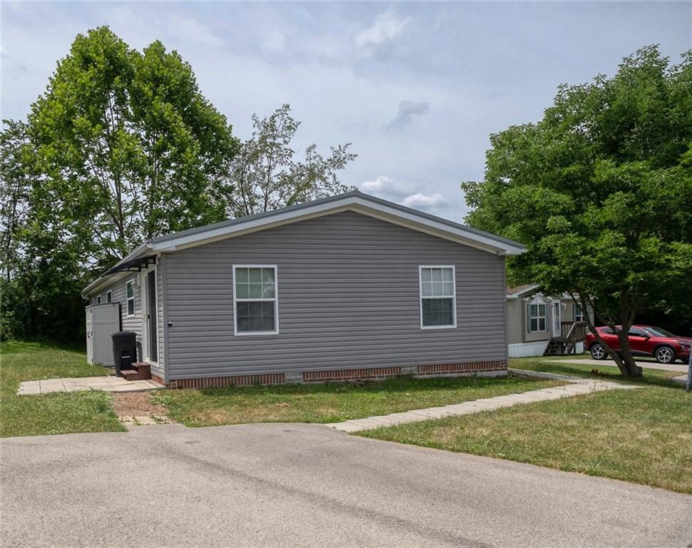 a view of house with yard