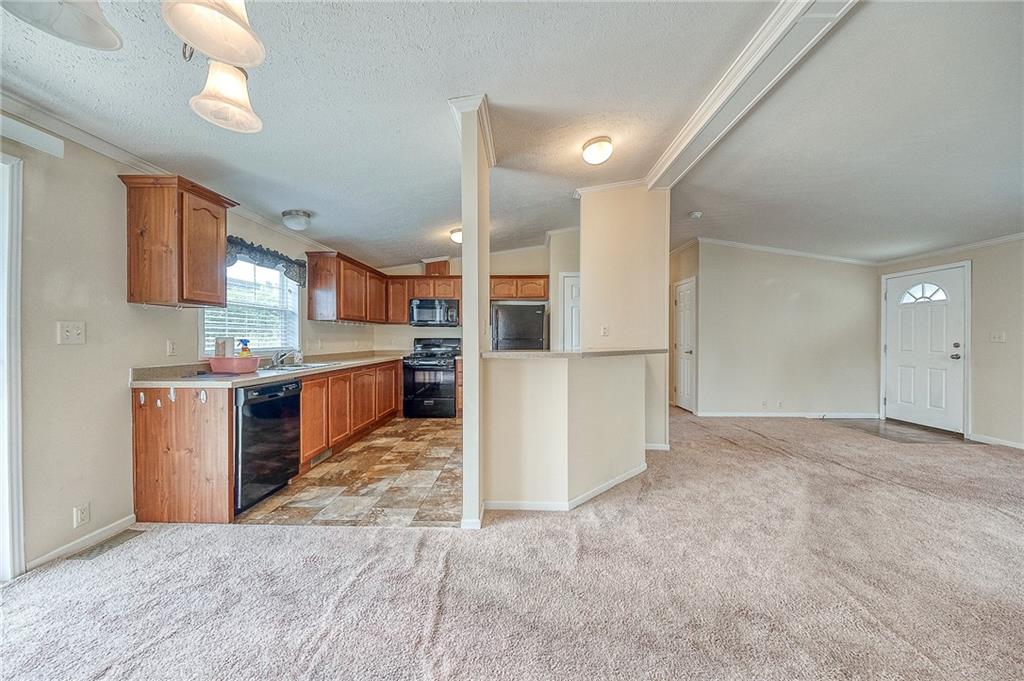 89 Delaware Drive Cheswick, PA 15024 - Photo 4 of 20 a view of a kitchen with refrigerator and cabinets