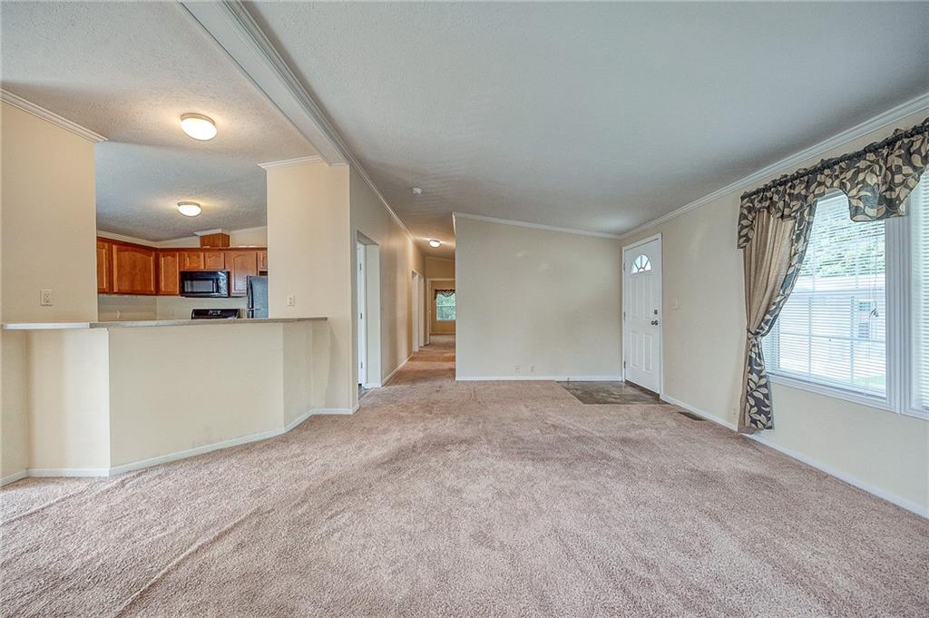 89 Delaware Drive Cheswick, PA 15024 - Photo 5 of 20 a view of a livingroom with kitchen and front door