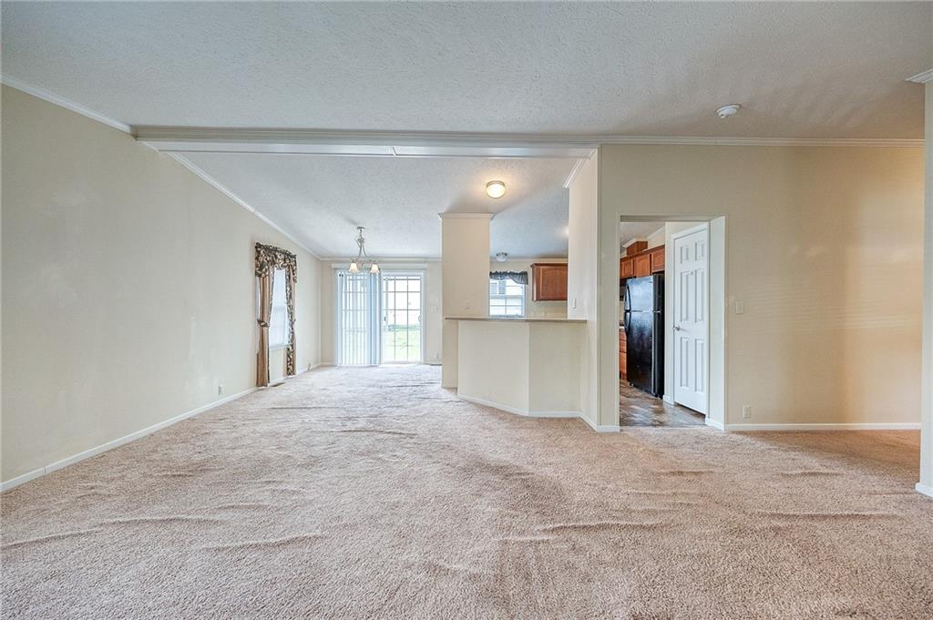 89 Delaware Drive Cheswick, PA 15024 - Photo 6 of 20 a view of a kitchen with refrigerator and windows