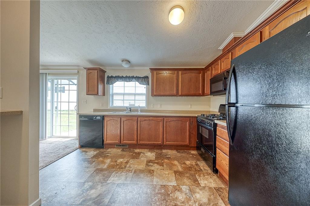 89 Delaware Drive Cheswick, PA 15024 - Photo 9 of 20 a kitchen with stainless steel appliances granite countertop a refrigerator and sink