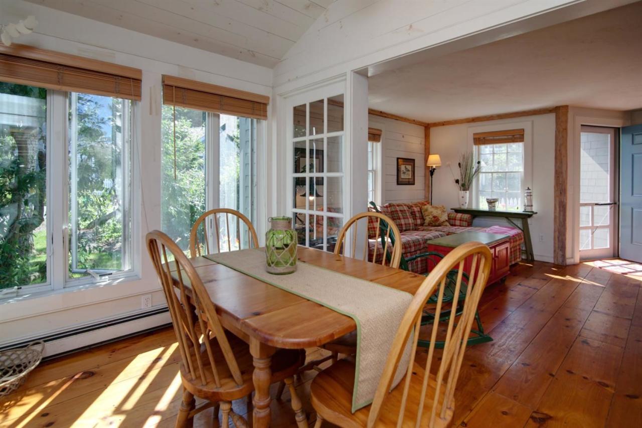 43 Brant Rock Road, Unit 43 Mashpee, MA 02649 - Photo 6 of 16 a view of a dining room with furniture and window