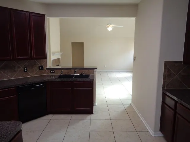 a kitchen with a sink and a stove