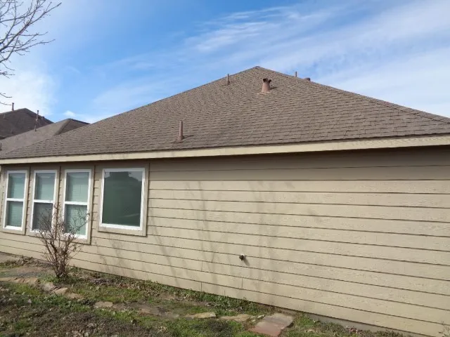 a view of house with backyard