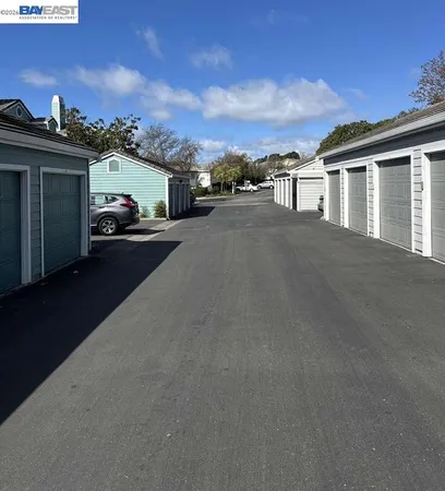 a view of a car park in front of a house