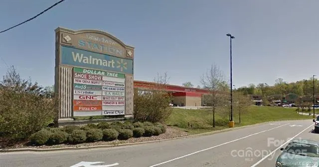 a sign board on the side of a road