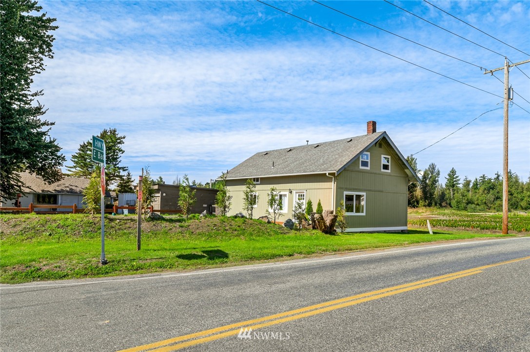 2890 East Badger Road Everson, WA 98247 - Photo 2 of 38 a view of green field with house in the background