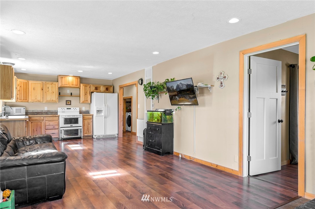 2890 East Badger Road Everson, WA 98247 - Photo 12 of 38 a living room with furniture and a wooden floor