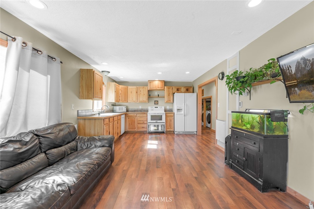 2890 East Badger Road Everson, WA 98247 - Photo 16 of 38 a living room with furniture and a wooden floor