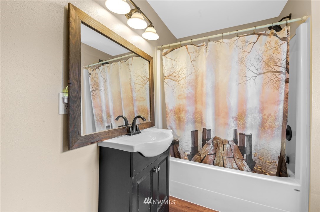 2890 East Badger Road Everson, WA 98247 - Photo 27 of 38 a bathroom with a sink and a mirror