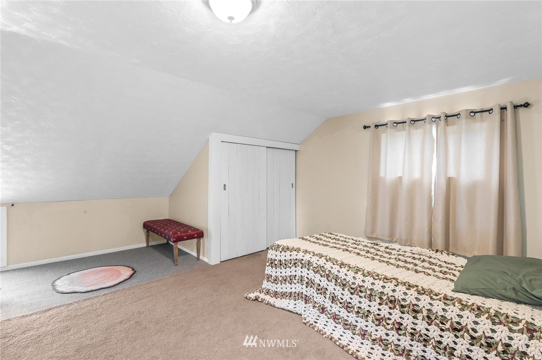 2890 East Badger Road Everson, WA 98247 - Photo 28 of 38 a bedroom with a bed and a chair