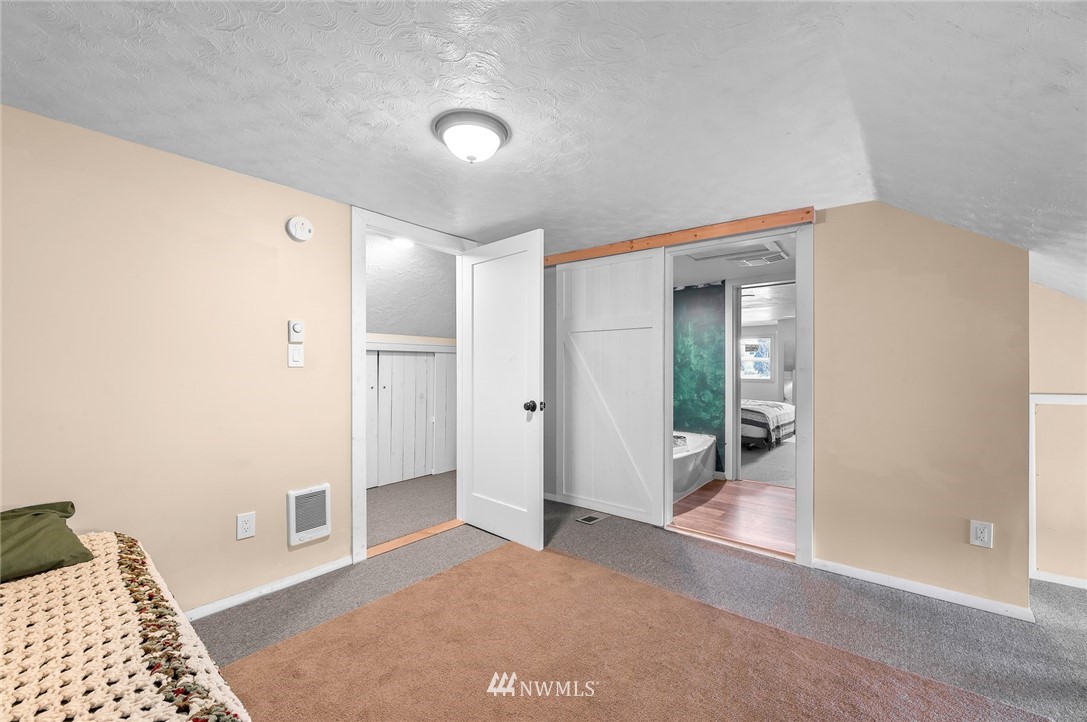 2890 East Badger Road Everson, WA 98247 - Photo 29 of 38 a view of a hallway with wooden floor and a living room