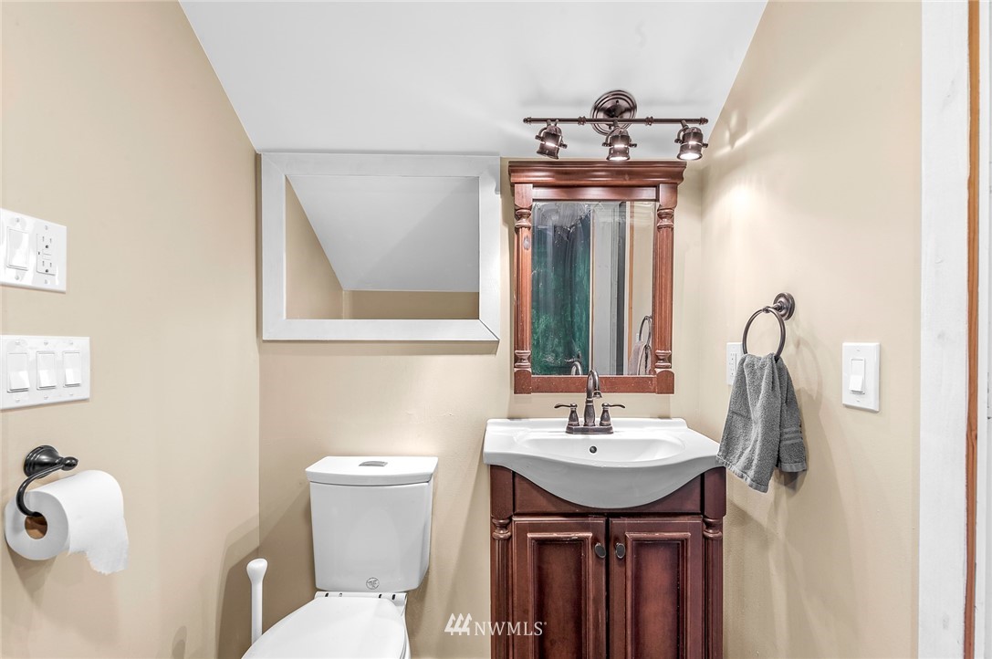 2890 East Badger Road Everson, WA 98247 - Photo 34 of 38 a bathroom with a sink and mirror