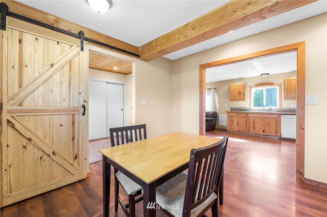 2890 East Badger Road Everson, WA 98247 - Photo 37 of 38 a view of a dining room with furniture window and wooden floor