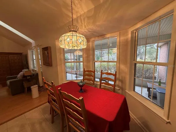 a view of a livingroom with furniture window and wooden floor