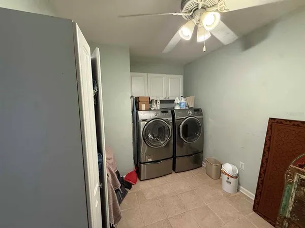 a view of a field with trees in background