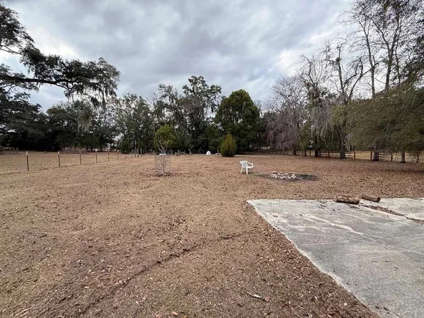 a view of backyard with cabin