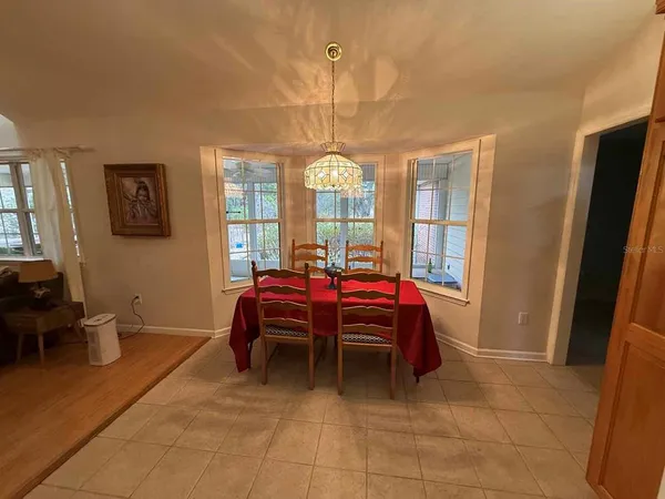 a living room with furniture a window and a table
