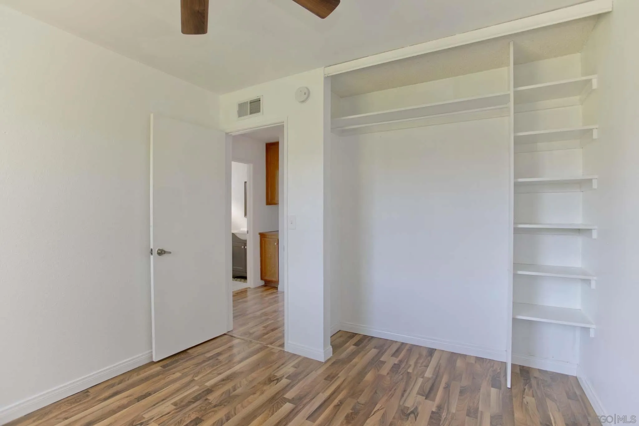 10076 West Glendon Circle Santee, CA 92071 - Photo 16 of 35 a view of empty room with wooden floor