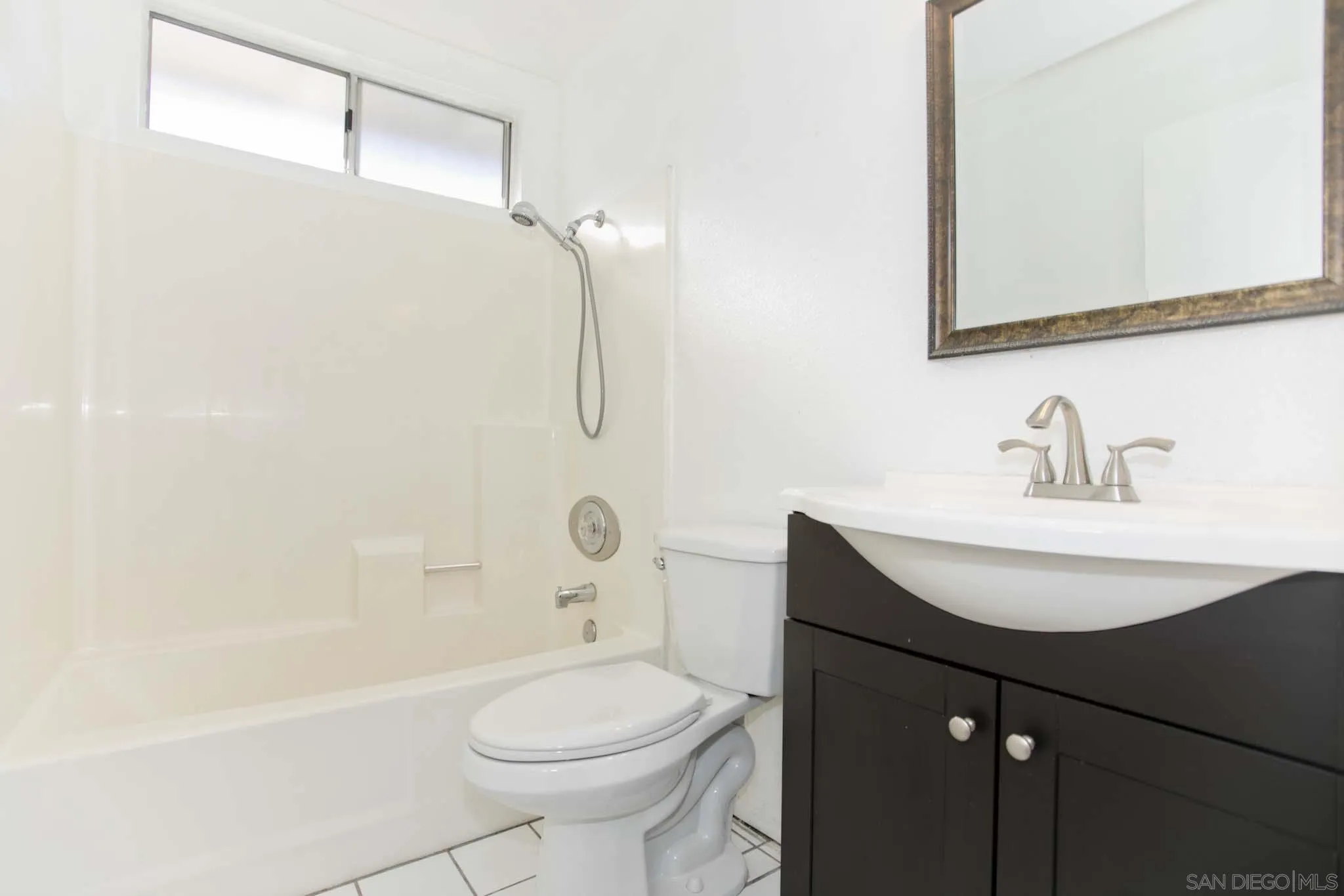 10076 West Glendon Circle Santee, CA 92071 - Photo 19 of 35 a bathroom with a sink toilet and shower