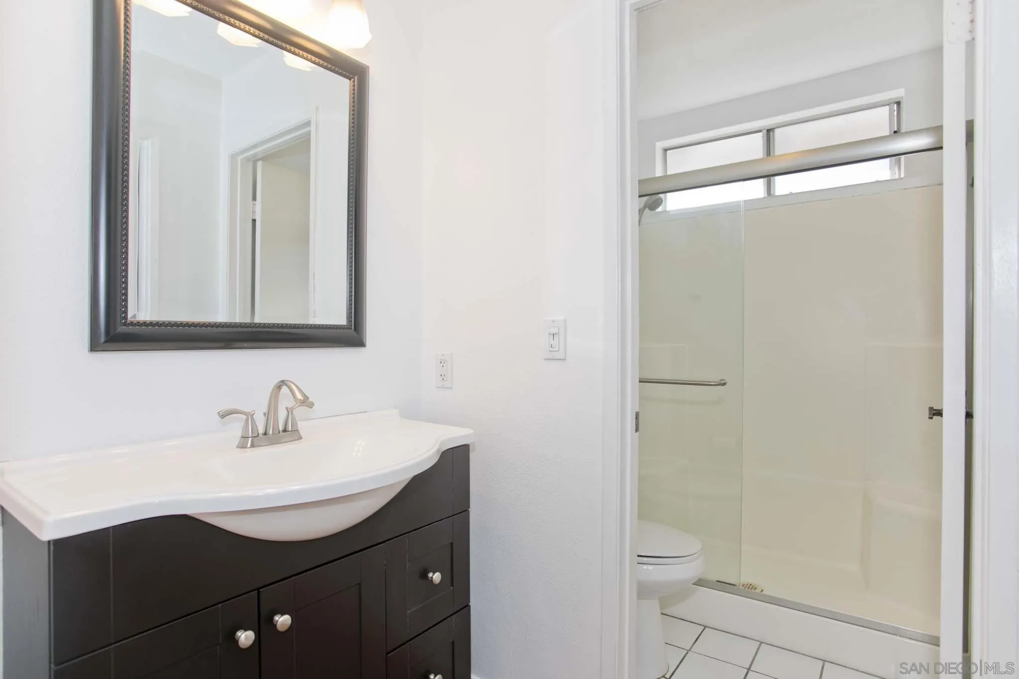 10076 West Glendon Circle Santee, CA 92071 - Photo 20 of 35 a bathroom with a sink toilet and shower