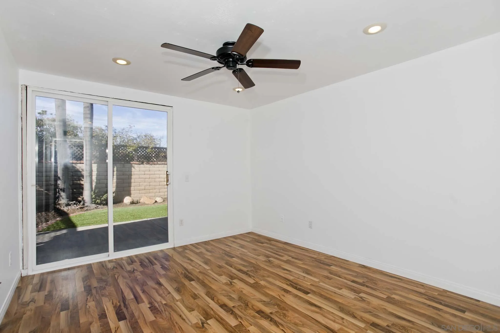 10076 West Glendon Circle Santee, CA 92071 - Photo 23 of 35 a view of empty room with wooden floor and fan