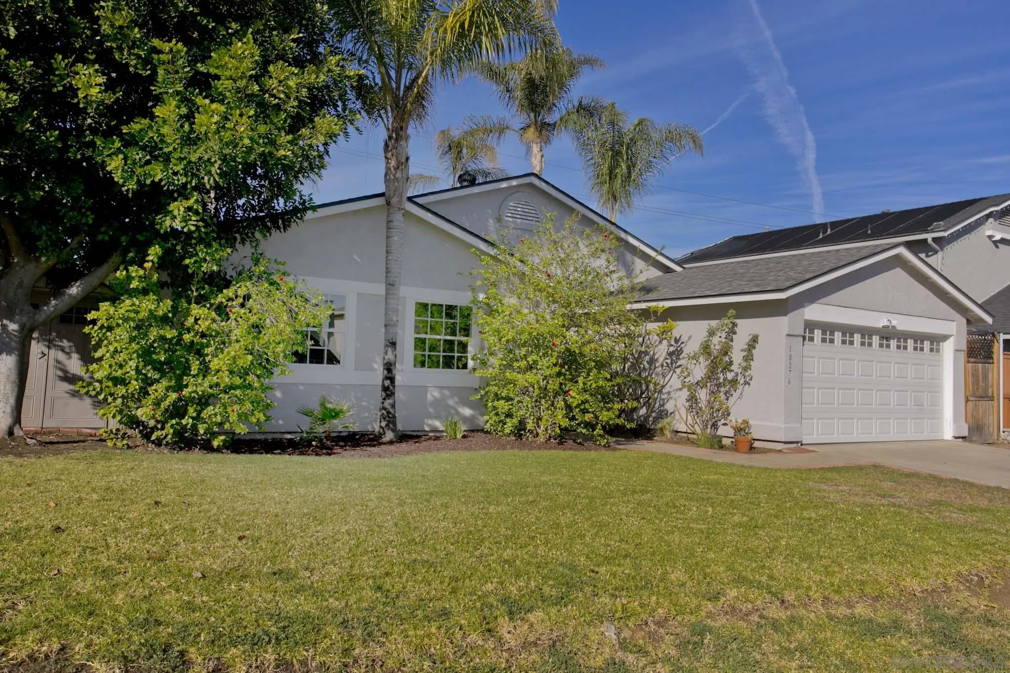 10076 West Glendon Circle Santee, CA 92071 - Photo 3 of 35 a view of a house with a yard and potted plants