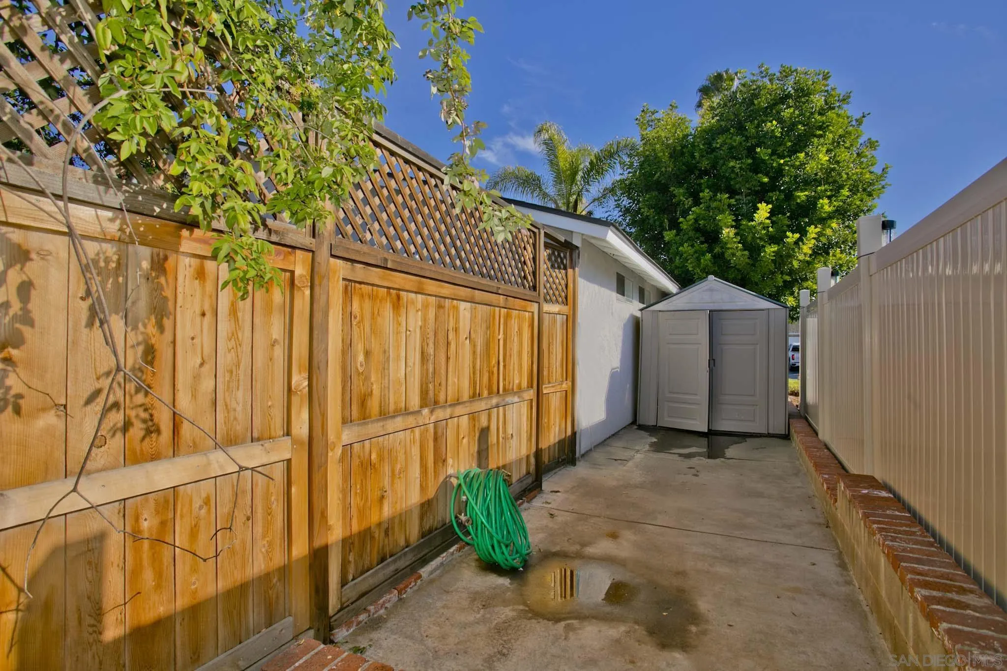 10076 West Glendon Circle Santee, CA 92071 - Photo 34 of 35 a view of a small house with wooden fence