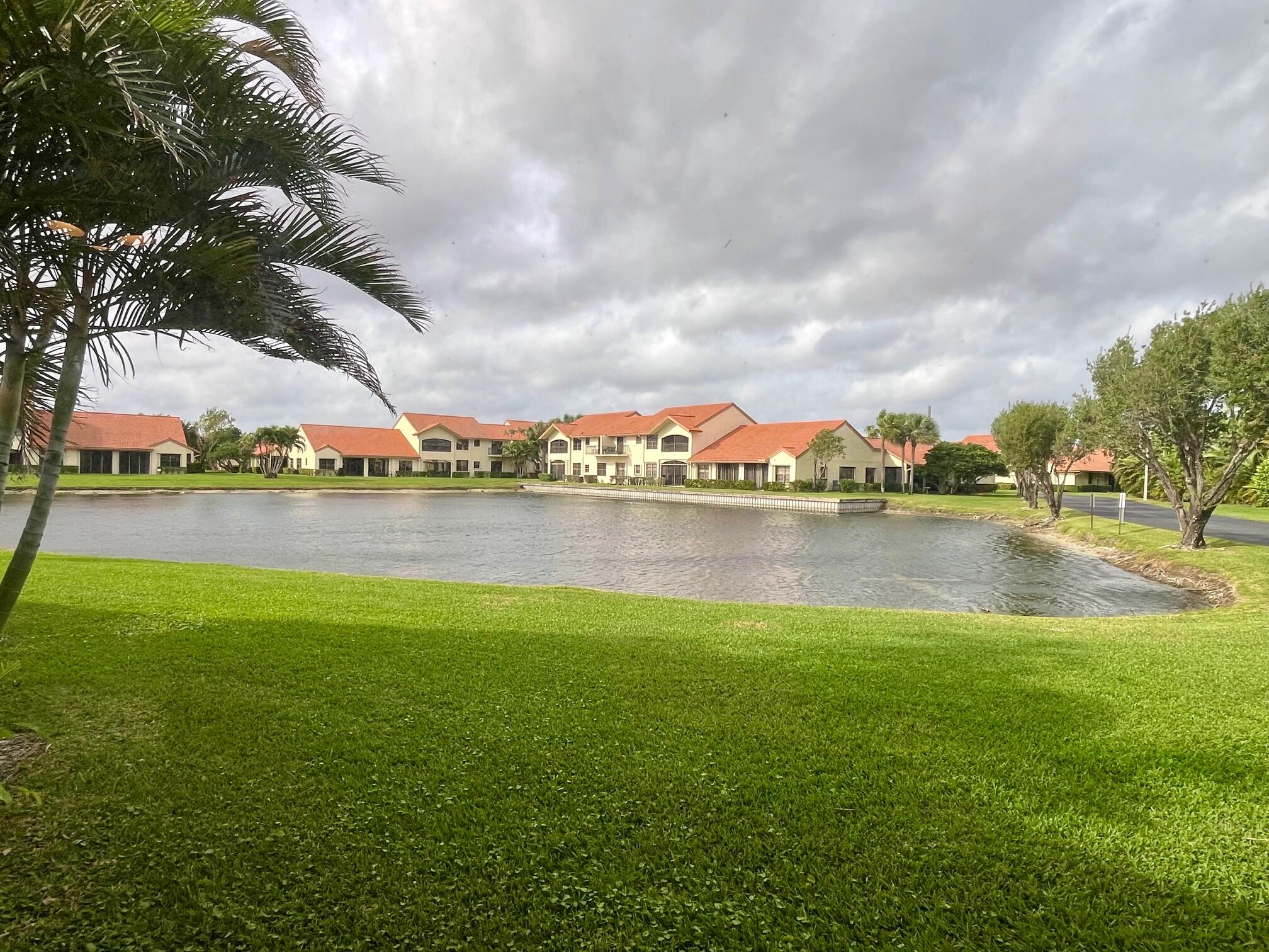 8300 Waterline Drive, Unit 105 Boynton Beach, FL 33472 - Photo 20 of 20 a view of a lake with houses