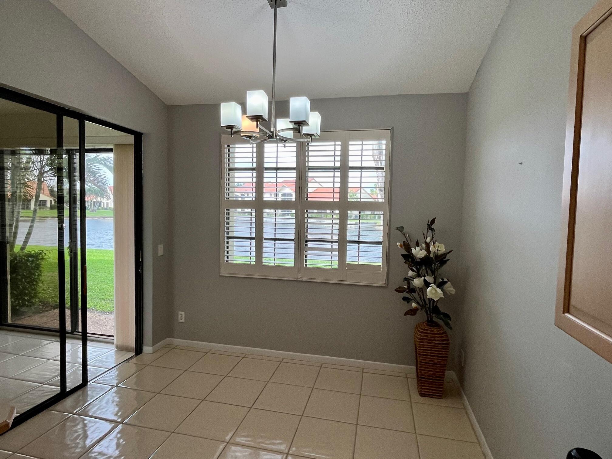 8300 Waterline Drive, Unit 105 Boynton Beach, FL 33472 - Photo 5 of 20 a view of an empty room with a window