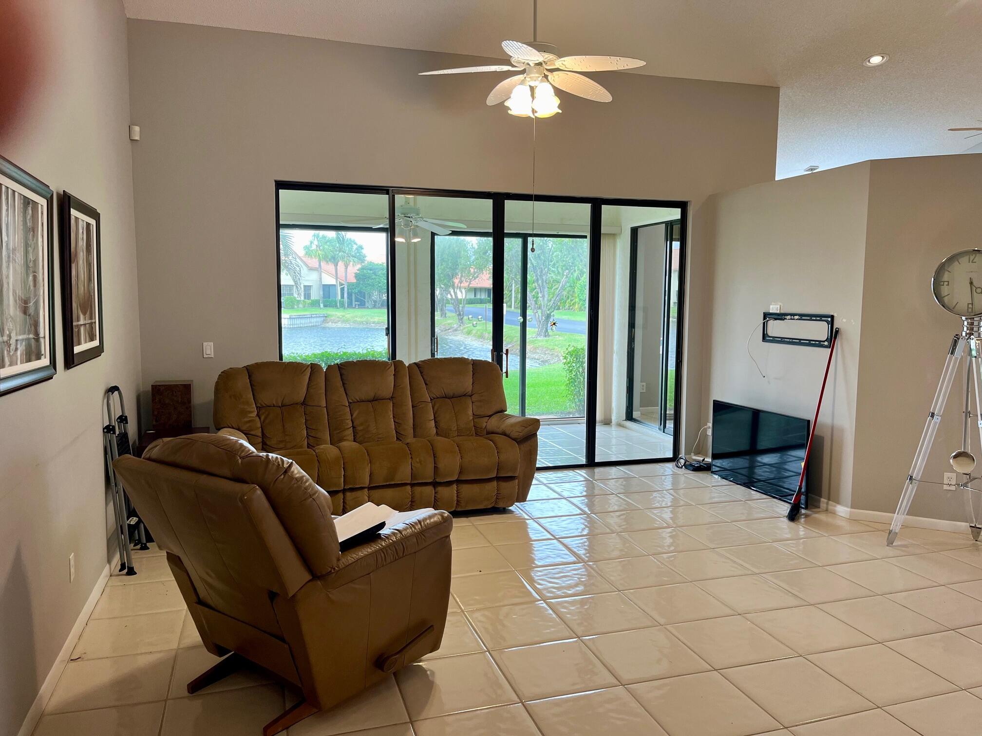 8300 Waterline Drive, Unit 105 Boynton Beach, FL 33472 - Photo 7 of 20 a living room with furniture and a large window