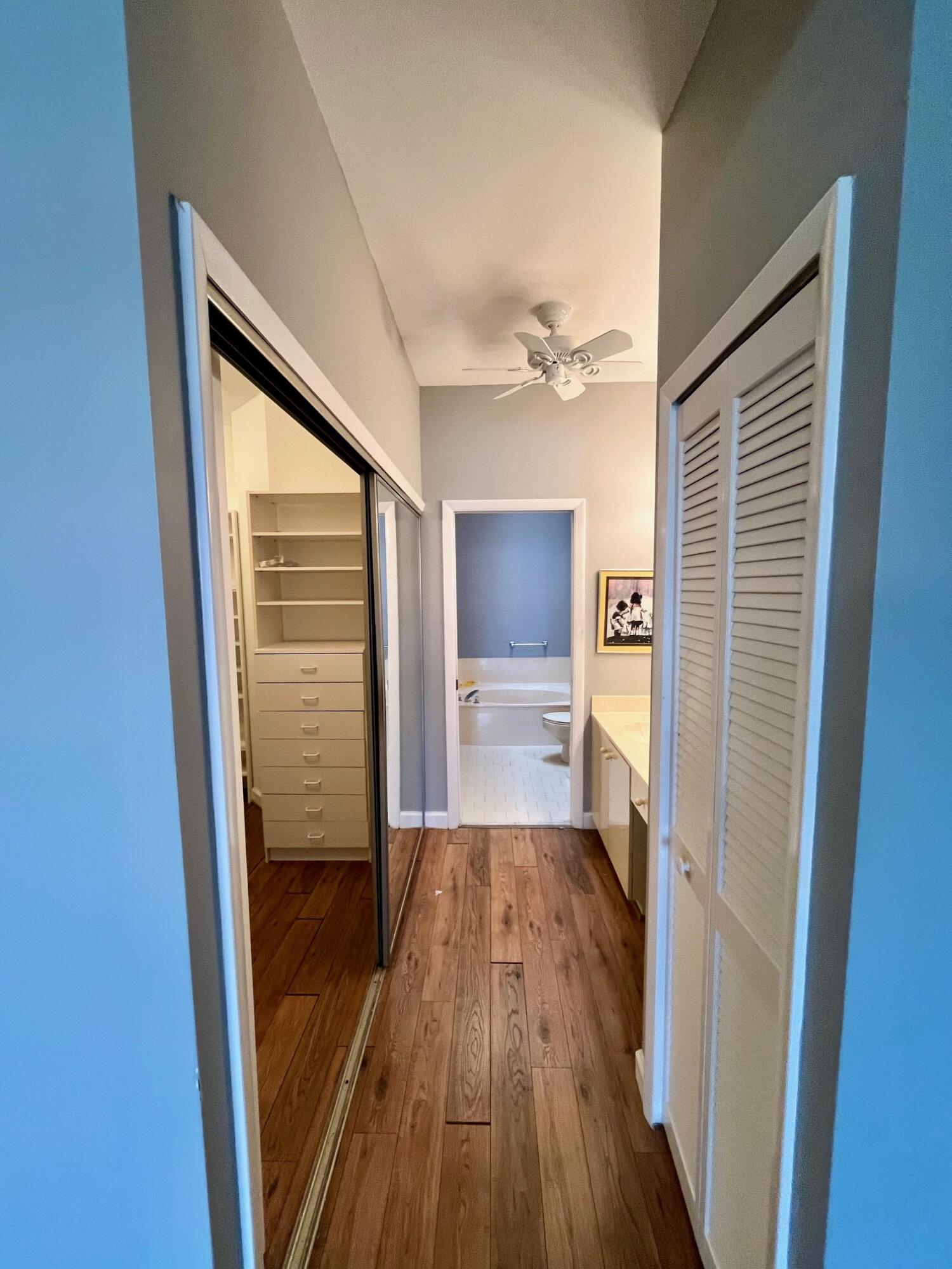 8300 Waterline Drive, Unit 105 Boynton Beach, FL 33472 - Photo 10 of 20 a view of a hallway with a hardwood floor