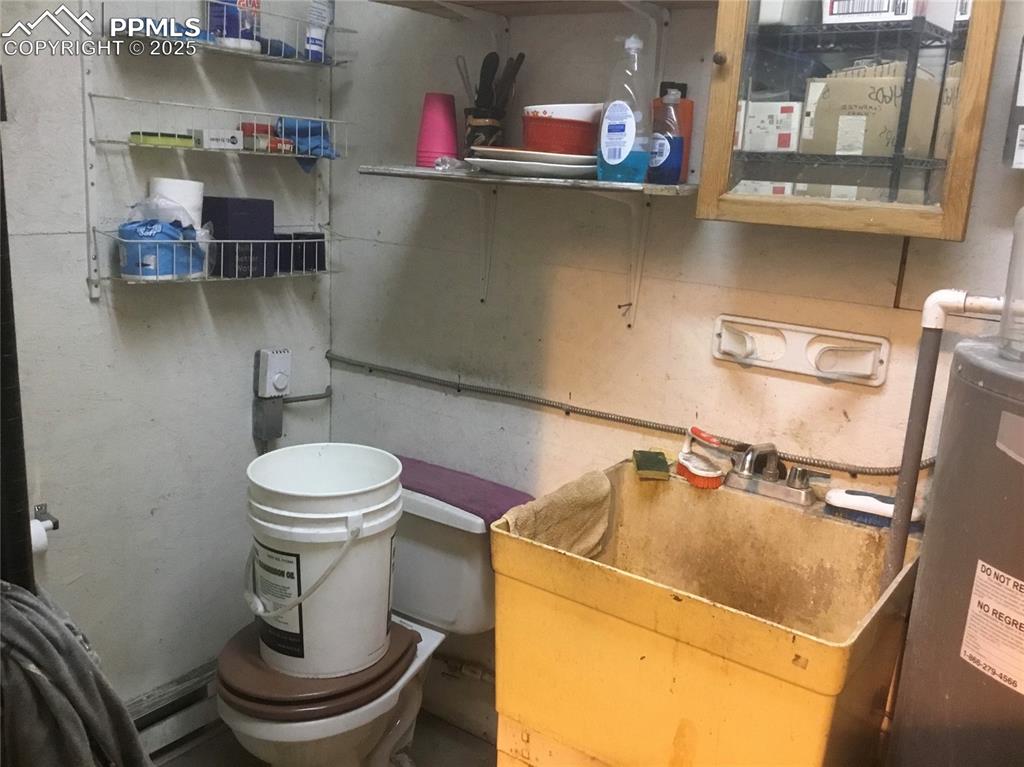 4407 Salt Cedar Road Fountain, CO 80817 - Photo 23 of 25 a bathroom with a sink and toilet