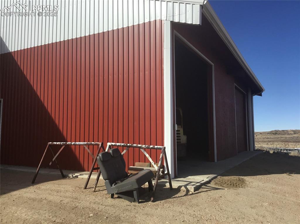 4407 Salt Cedar Road Fountain, CO 80817 - Photo 3 of 25 a backyard of a house with table and chairs