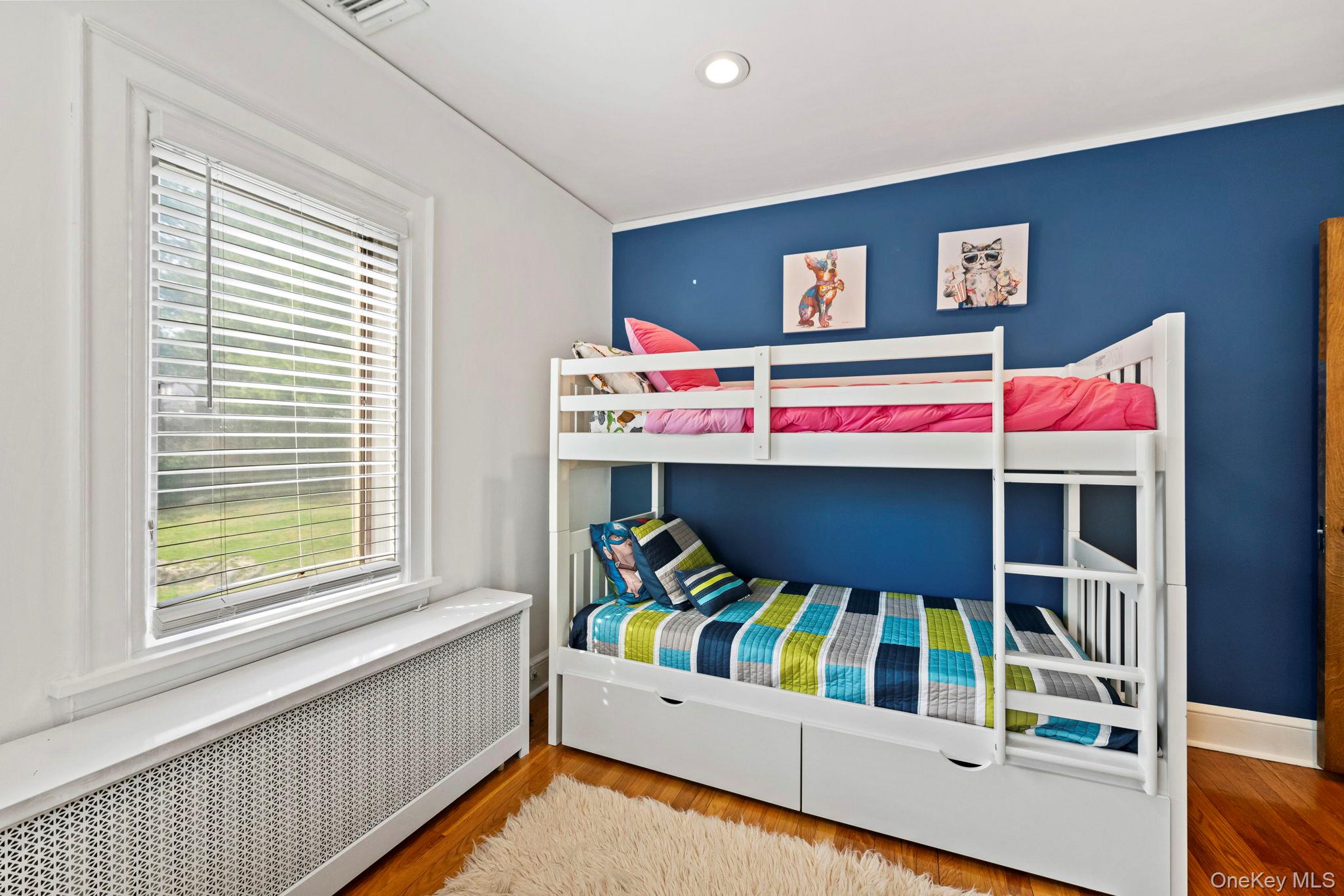44 Fenimore Road New Rochelle, NY 10804 - Photo 31 of 46 a bedroom with a bed and a bookshelf