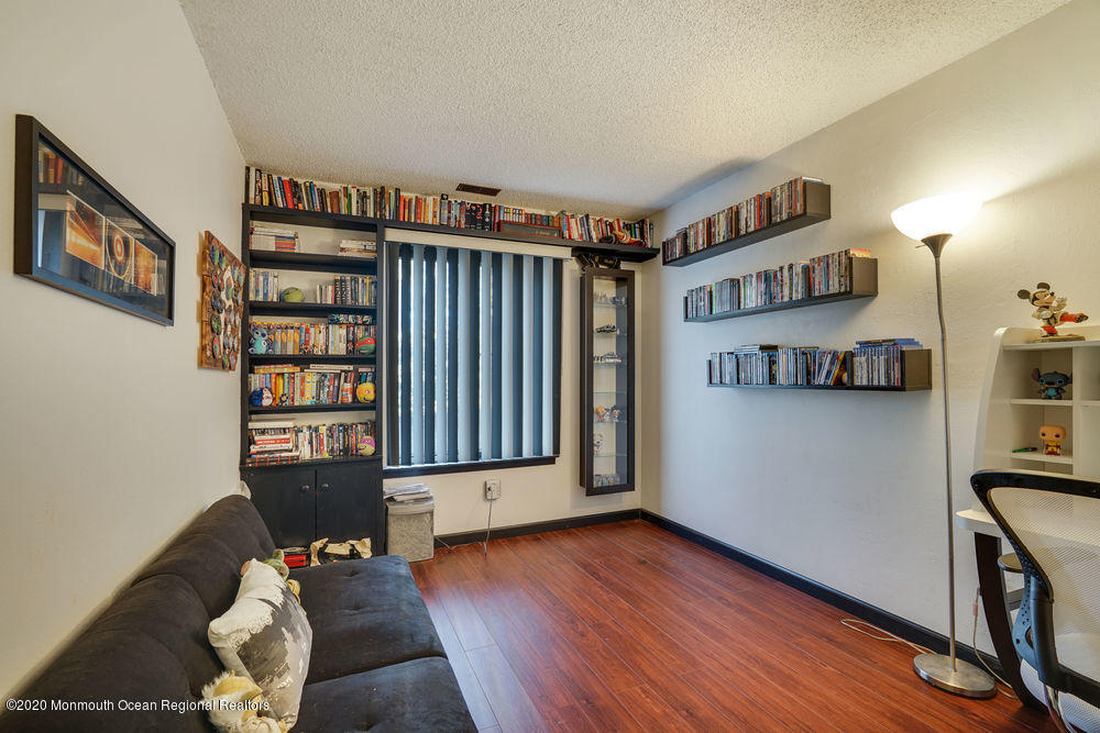 89 Northrup Drive, Unit 75 Brick, NJ 08724 - Photo 15 of 24 a view of an empty room and wooden floor