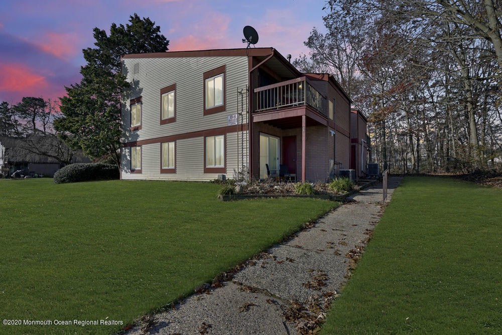 89 Northrup Drive, Unit 75 Brick, NJ 08724 - Photo 24 of 24 a front view of a house with a garden