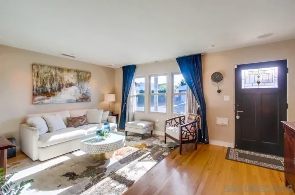 a living room with furniture and a large window