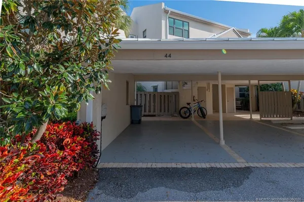 a living room with furniture dining table and a wooden floor