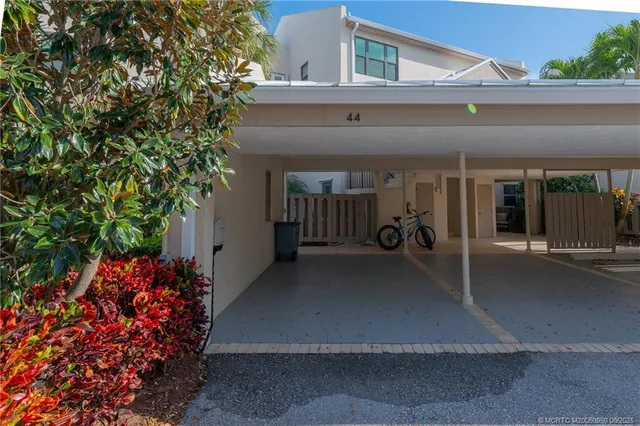 a living room with furniture dining table and a wooden floor