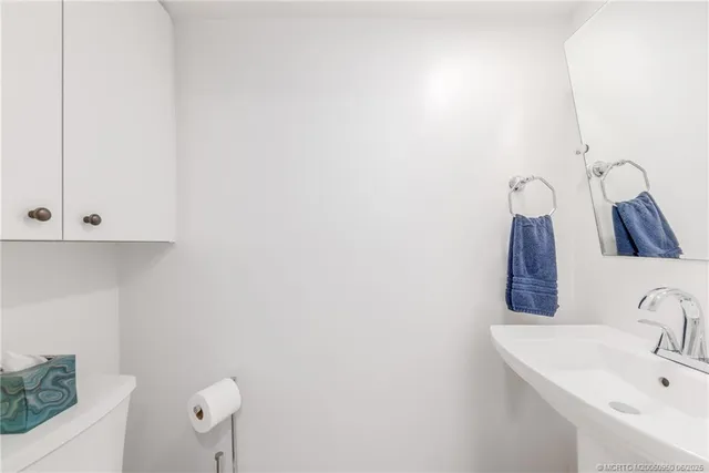 a spacious bedroom with a large bed and a window